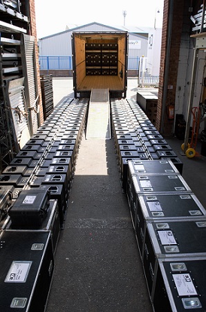 A busy day with lines of d&b loudspeakers awaiting loading