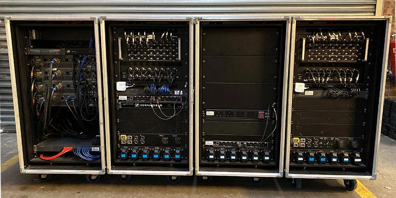 Back of custom hybrid RF, stage box and amplifier touring rack